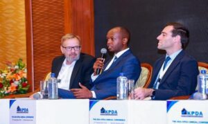 Centum Real Estate Managing Director (center) speaking at the 2024 KPDA annual conference 